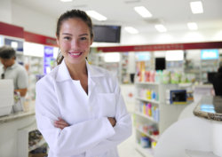 portrait of a female pharmacist at pharmacy